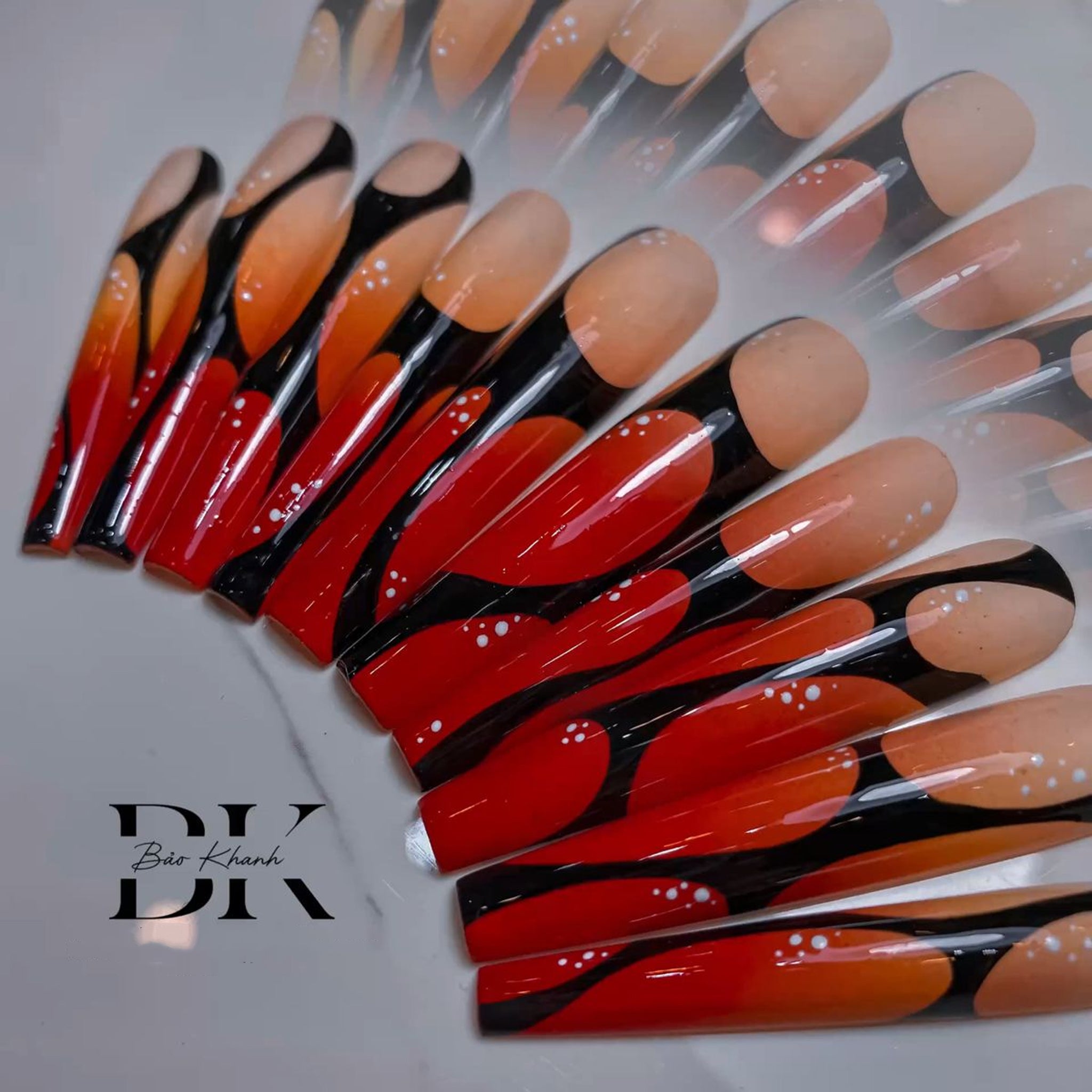 Handmade Long Coffin Press-On Nails – Red & Orange Gradient with Bold Black Abstract Design