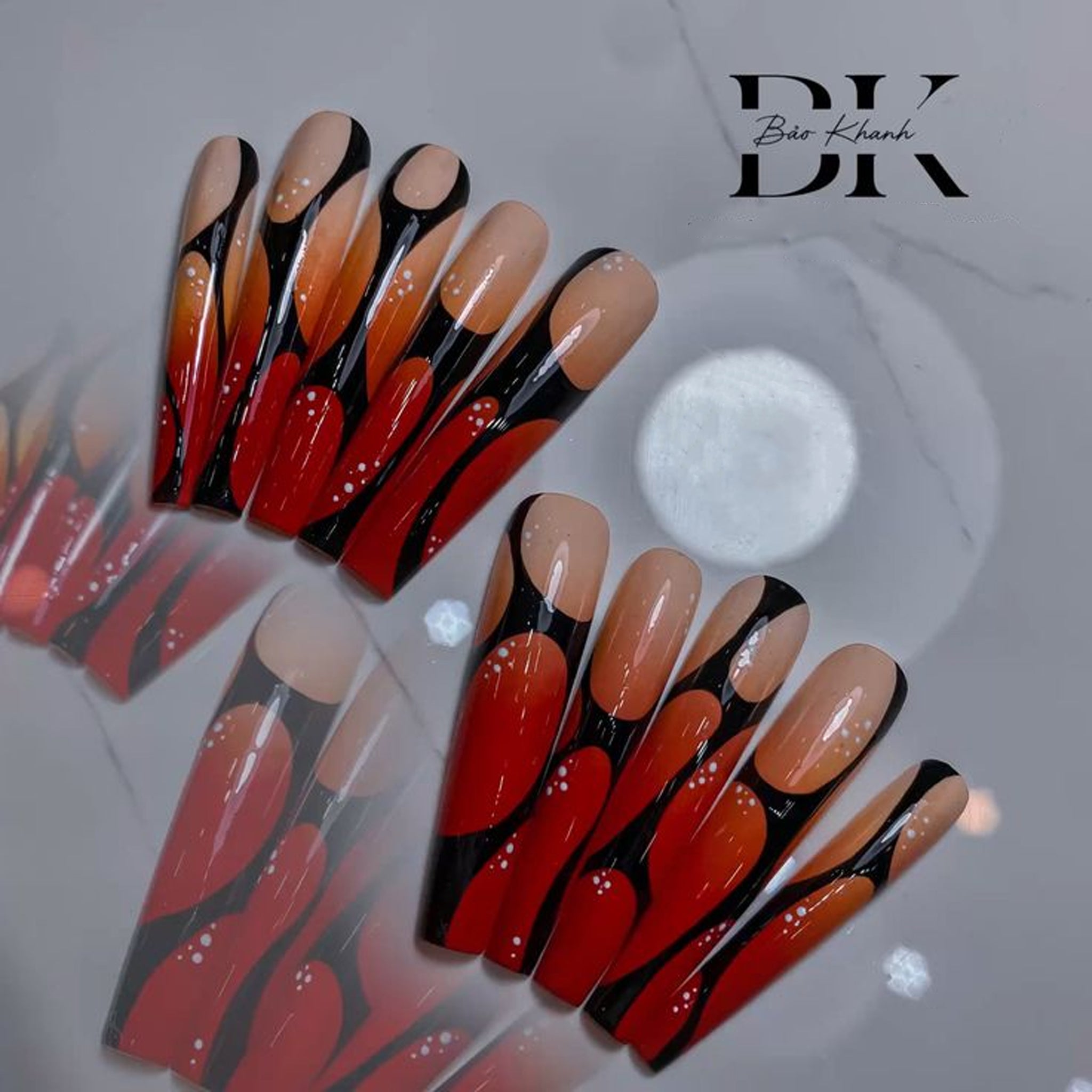 Handmade Long Coffin Press-On Nails – Red & Orange Gradient with Bold Black Abstract Design